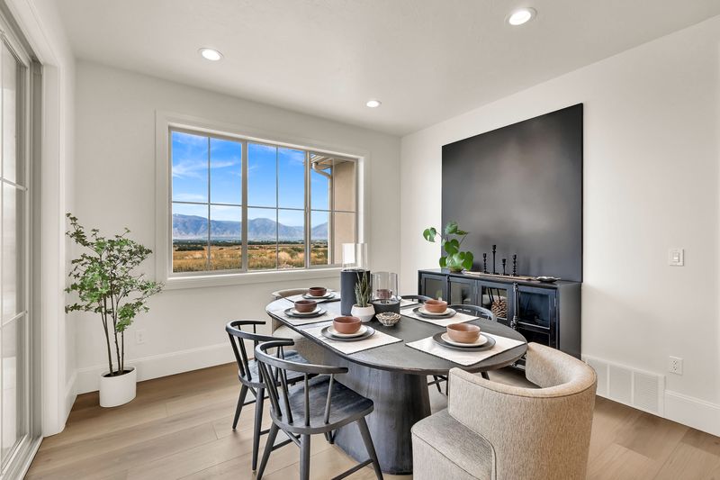 Dining area from the kitchen side, with a built-in cabinet along the wall