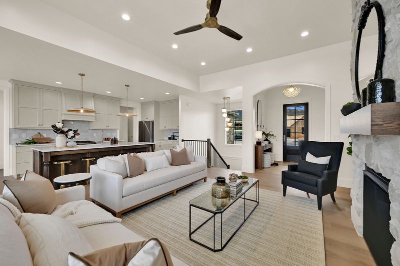 Open plan living, dining and kitchen seen from the corner of the great room