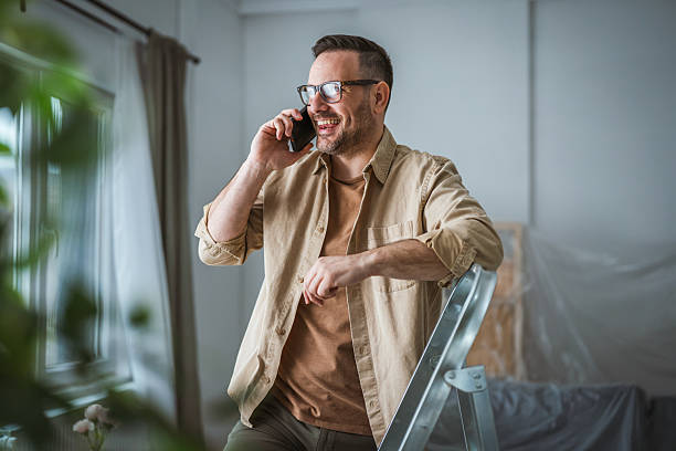 A homeowner on a call with their builder after move-in